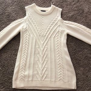 White knit sweater with shoulder cut outs